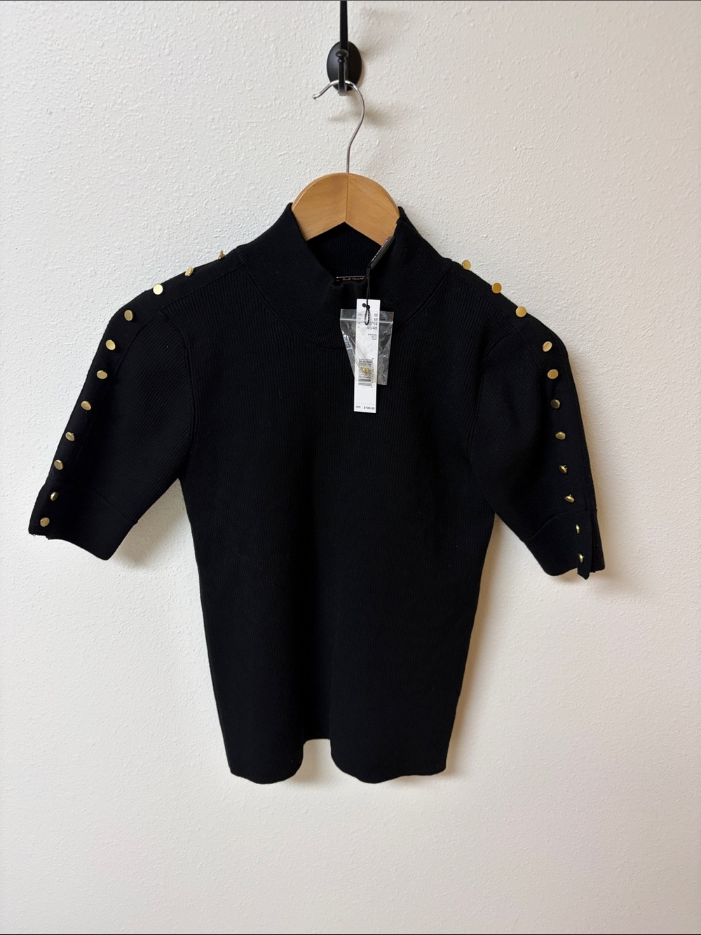 Elie Tahari black knit top with gold button accents. Women’s size M, NWT